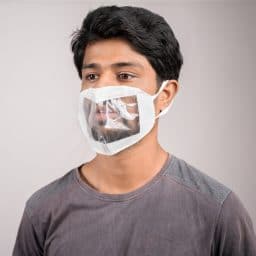 young man with transparent Medical face mask, to help hearing impermeant or deaf people to understand lipreading during coronavirus or covid-19 outbreak.