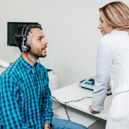 Man gets a hearing evaluation.