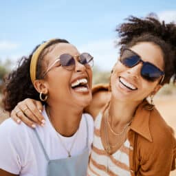 Two friends laughing together