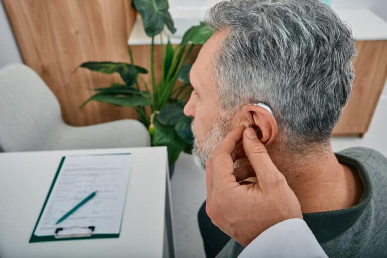 Man is fitted with hearing aid 