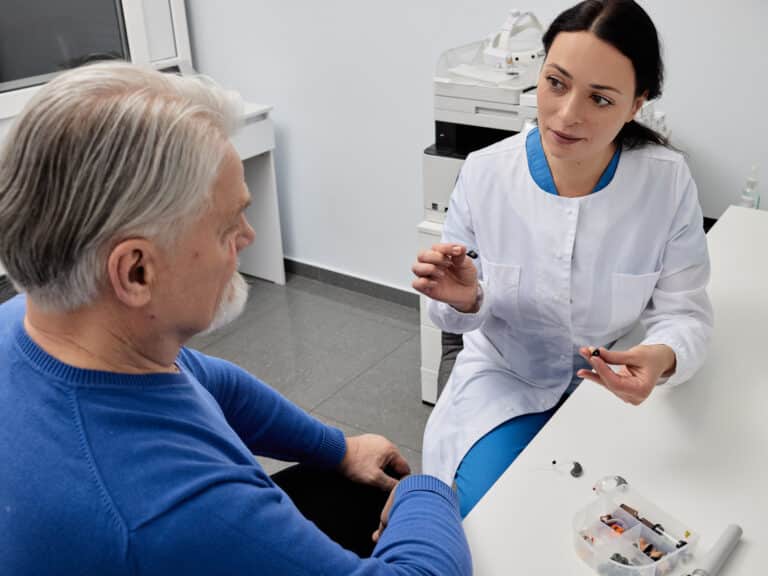 Audiologist discussing hearing aids with her patient