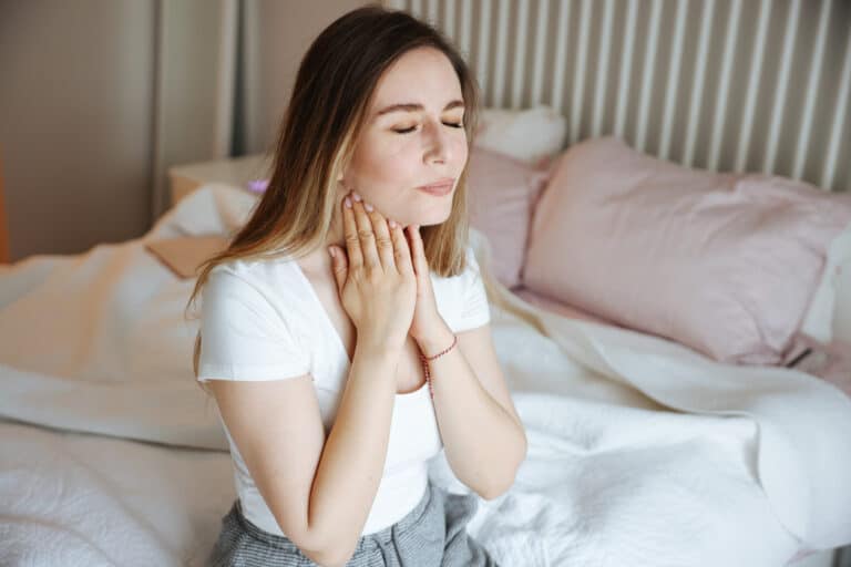 Woman checking her lymph nodes